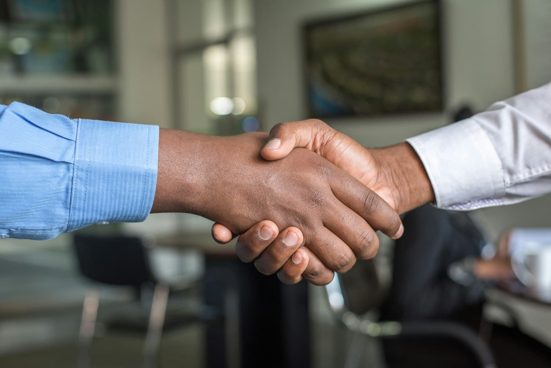 Close-up of a handshake between two business partners in an office